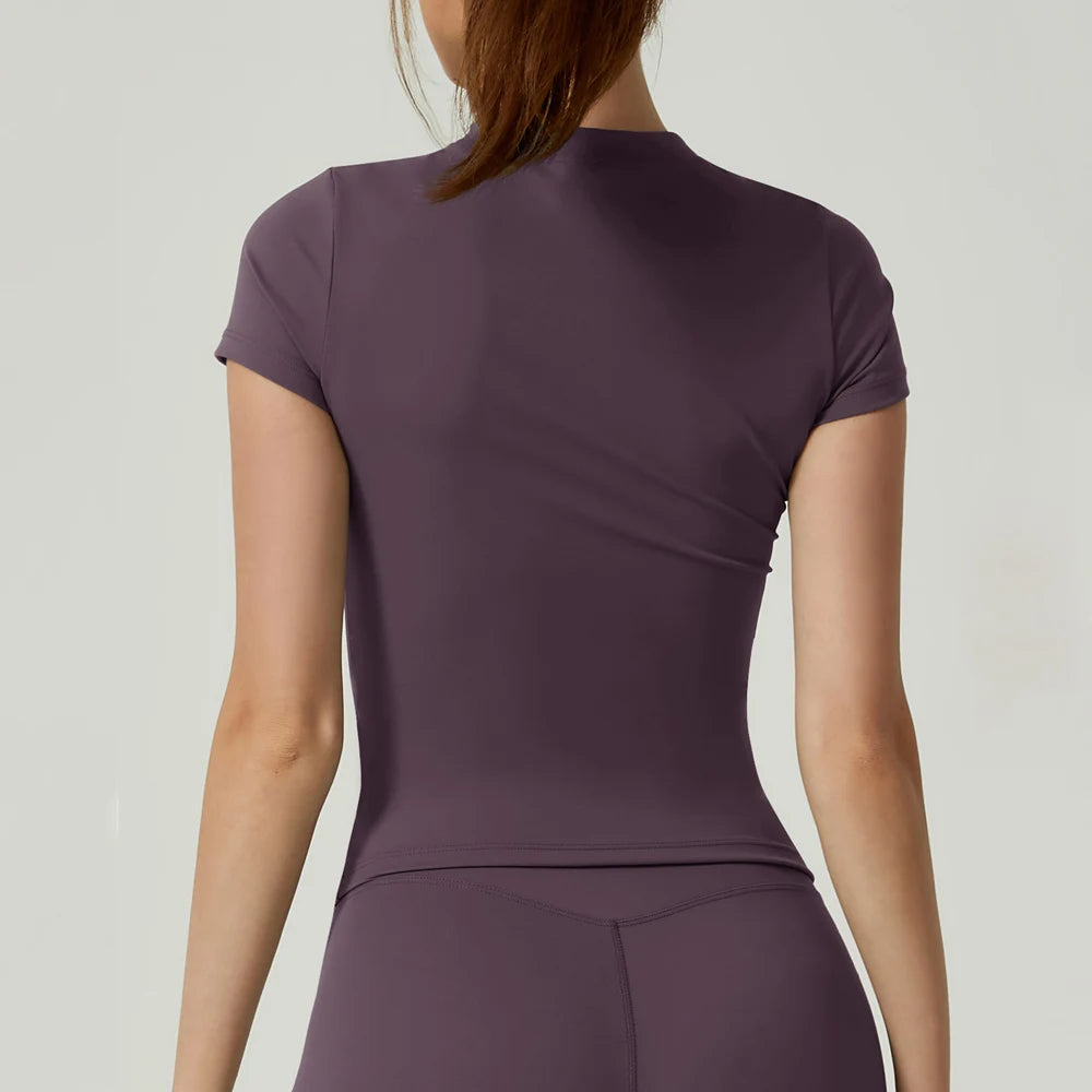 Capilorix women's seamless gym crop top, short sleeve yoga and fitness sports T-shirt for running and workout activities.