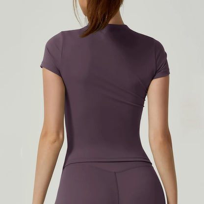 Capilorix women's seamless gym crop top, short sleeve yoga and fitness sports T-shirt for running and workout activities.