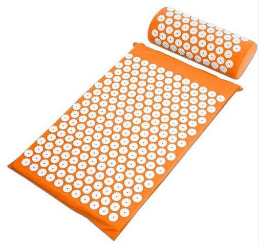 Capilorix acupuncture yoga cushion and massage pillow with activewear jumpsuit in the background, designed for comfort and relaxation.
