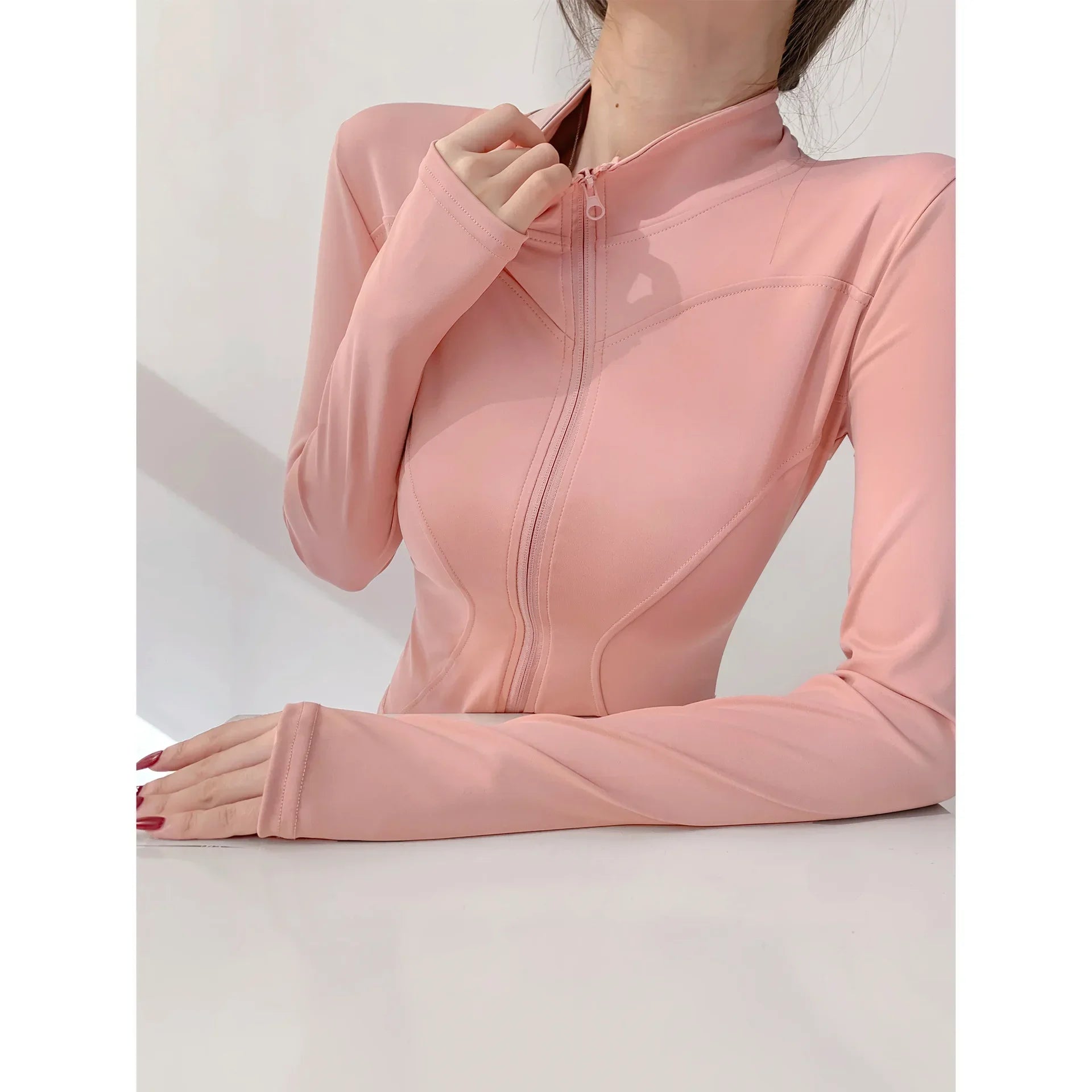 Capilorix women's quick-drying sports coat with long sleeves, zipper, and tight fit for yoga, running, and fitness activities.