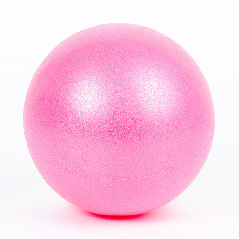 Capilorix dance fitness massage wheat tube yoga ball in activewear jumpsuit, showing its comfortable fit and textured surface.