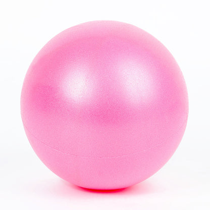 Capilorix dance fitness massage wheat tube yoga ball in activewear jumpsuit, showing its comfortable fit and textured surface.