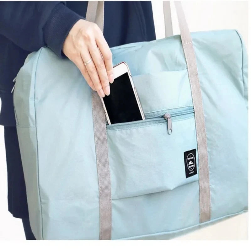 Capilorix foldable travel duffel bag for women, lightweight and large capacity for airline carry-on, ideal for weekend trips.