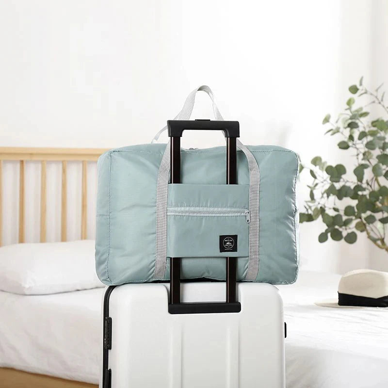 Capilorix foldable travel duffel bag for women, lightweight carry-on with large capacity, ideal for weekend trips and overnight travel.