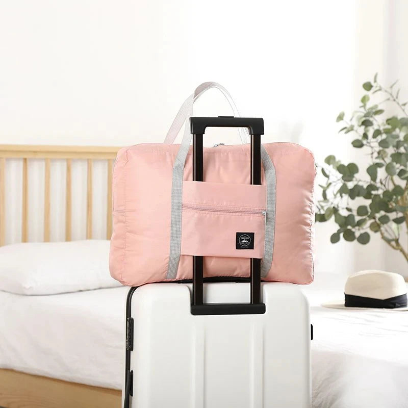 Capilorix foldable travel duffel bag for women and girls, lightweight, large capacity carry-on bag for weekend trips and sports activities.