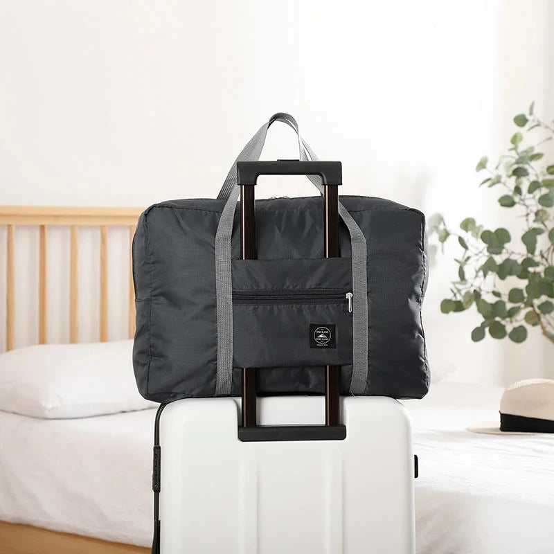 Capilorix foldable travel duffel bag for women, lightweight, large capacity carry-on bag for weekend trips and sports travel.