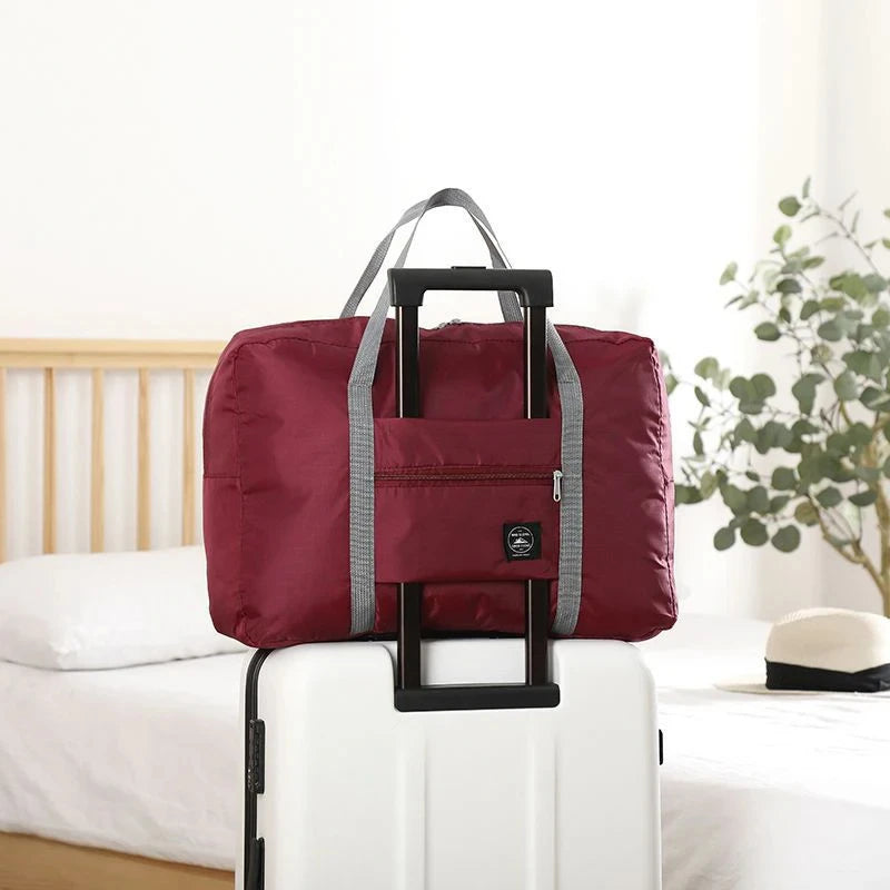 Capilorix foldable travel duffel bag for women, lightweight carry-on with large capacity for weekend trips and sports activities.