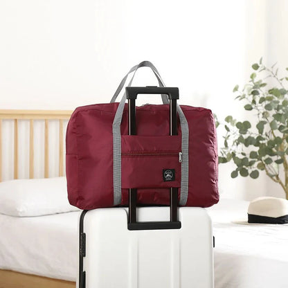 Capilorix foldable travel duffel bag for women, lightweight carry-on with large capacity for weekend trips and sports activities.
