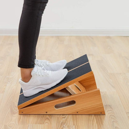Capilorix wooden adjustable angle stretch board for fitness exercises, featuring a natural wooden surface and adjustable tilt for stretching.