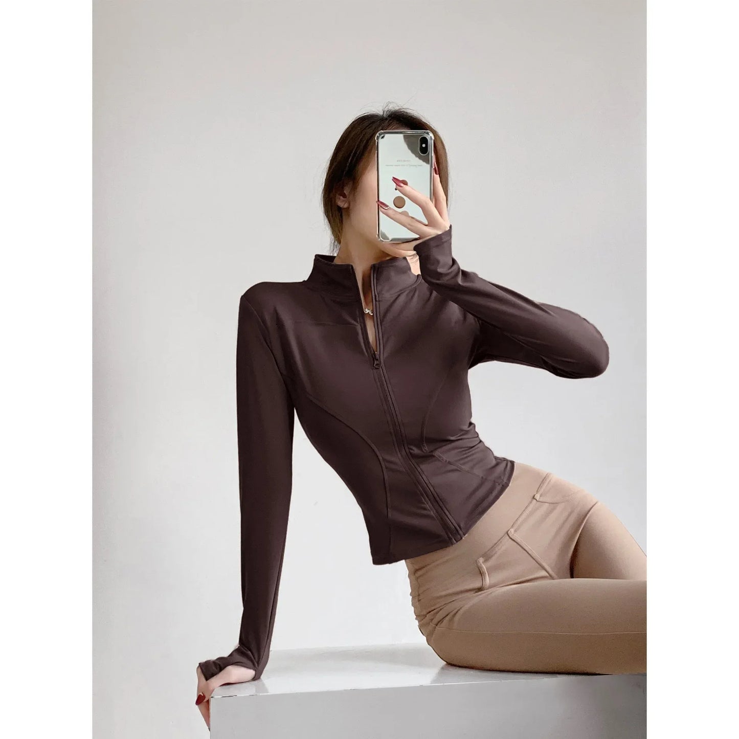 Capilorix women's quick-drying sports coat with long sleeves, zipper, and tight fit ideal for yoga, running, and fitness activities.